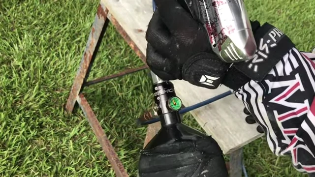 Filling a paintball tank at a fill station
