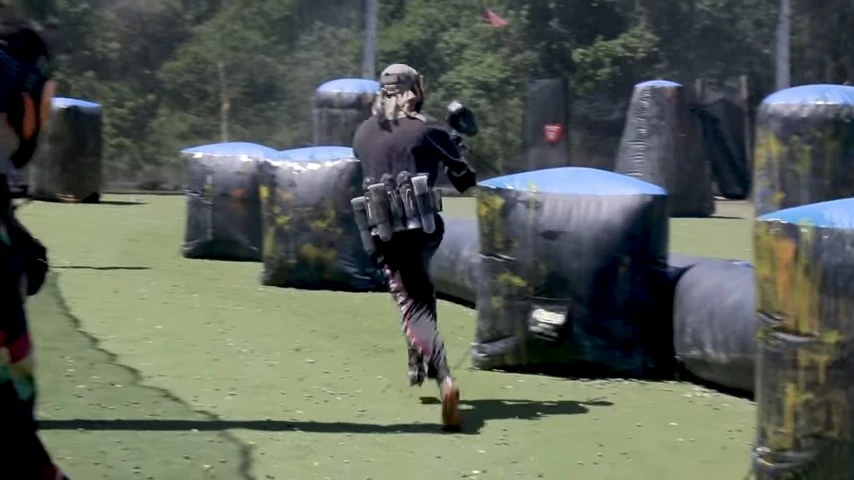 Beginner paintball player learning the basics on the field