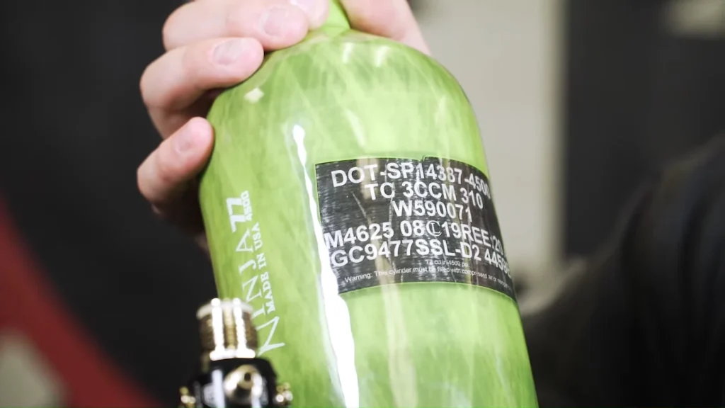 Hydrostatic test date stamped on a paintball tank