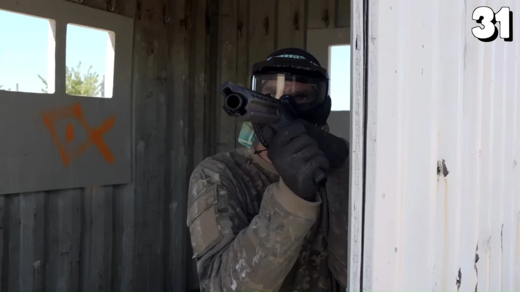 Two even teams lined up for a paintball match