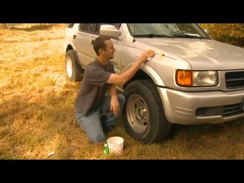 Washing paintball residue off a car with shampoo and a mitt