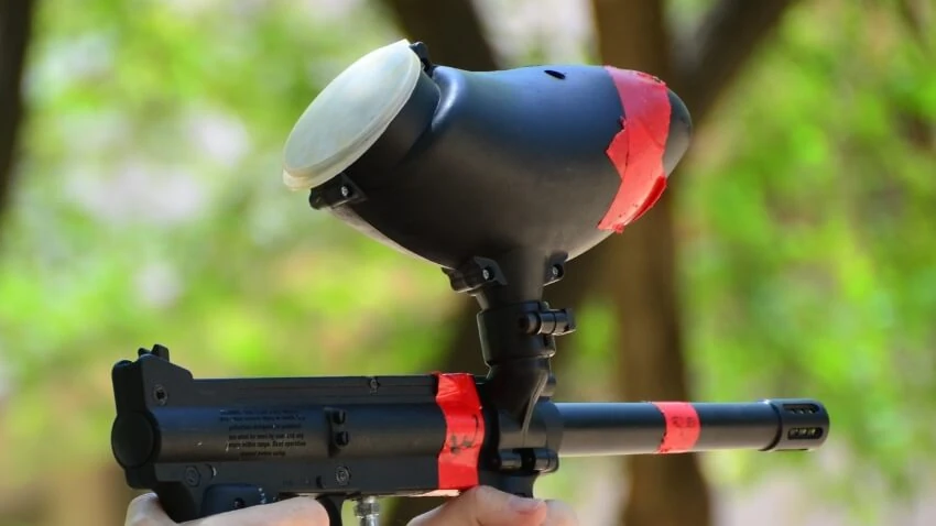A used paintball marker being passed on to a new player